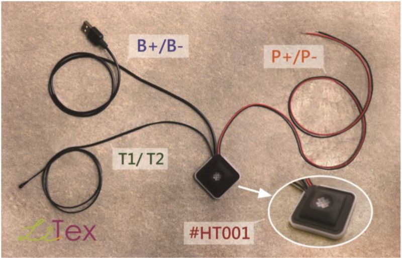 The HT001 switch with its three lead pairs annotated: battery input B+/B-, temperature sensor T1/T2, and heating textile output P+/P-